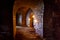 Dungeon under the old german fortress illuminated by lantern and