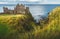 Dunluce castle on the cliff. Irish shoreline.