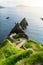 Dunquin or Dun Chaoin pier, Ireland\\\'s Sheep Highway. Narrow pathway winding down to the pier,