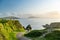 Dunquin or Dun Chaoin pier, Ireland\\\'s Sheep Highway. Narrow pathway winding down to the pier, ocean coastline, cliffs