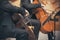 A Duo of two musicians, who play the cellos with bows