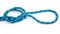 durable colored rope for climbing equipment on a white background. knot of braided cable. item for tourism and travel