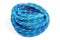 durable colored rope for climbing equipment on a white background. knot of braided cable. item for tourism and travel