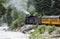 The Durango and Silverton Narrow Gauge Railroad Steam Engine travels along Animas River, Colorado, USA