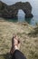 Durdle Door - the arch and feet in sandals.