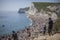 Durdle Door - people walking down the stairs towards the beach.