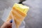 Durian Ice Cream in a waffle in a woman`s hand, made of Durian Durio, asian fruit having strong, smelly odour