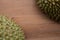 Durian on the wooden table with empty space on the middle