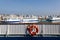 Durres, Albania, July 4 2019: View from a passenger ferry with a lifebuoy in the foreground over the city of Durres with other