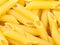 Durum wheat semolina pasta penne rigate close up