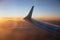 Dusk above clouds through airplane window