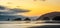 Dusk at Cannon Beach with shoreline and silhouetted sea stacks, Oregon Coast scenery or landscape, Usa