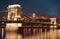 Dusk cityscape of the Chain bridge across the river Danube with the Buda castle in the background in the Hungarian capital Budape