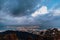 Dusk cloudy sky, cityscape and mountain with green that viewed from Penang Hill at George Town. Penang, Malaysia