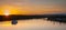 Dusk falls over the city and river as riverboats of tourists enjoy the evening.