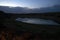 Dusk lake sunset in steppe on light background. Natural light. Sunset river water reflection.