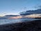 Dusk on the ocean on Kaimana Beach with Waikiki in the distance and boats on the water