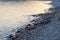 Dusk Reflections on Rocky Beach, Greece