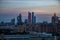 Dusk scape of Moscow City in construction on coloured blue and red cloudy sky. Evening after sunset panoramic photo