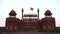 dusk tilt up shot of red fort's famous lahori gate in old delhi