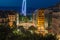 Dusk view of night city streets and illuminated landmark Geneva Water Fountain Jet d`Eau, Geneva, Switzerland