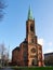Dusseldorf, Germany - December 25, 2020: Johannes Church on a sunny morning. Evangelical Church with a clock on the tower