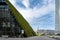 Dusseldorf - urban redevelopment. Diagonally rising walkable green roof, three-slice high-rise, modern architecture, green walls