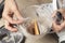 dust, animal hair and fur in women hands. Cleaning the container after using vacuum cleaner