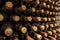 Dust and cobwebs on old winebottles in winery cellar