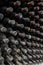 Dust covered wine bottles aging in an underground winery