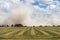 Dust storm, northern California hay field