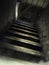 Dusty attic stairs with cobwebs