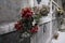 Dusty fake flowers on old grave stones