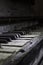 Dusty old piano with broken keys, close up