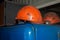 Dusty orange helmets. Safety concept