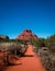 Dusty trail leading to beautiful red Bell Rock mountain in Sedona Arizona