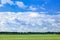 Dutch agrarian landscape with dramatic shaped clouds