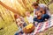 Dutch angle shallow focus shot of a happy family having a picnic in a forest