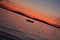 Dutch angle shot of a fishing boat in Walchensee lake, Bavaria, Germany.