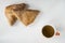 Dutch appelflap, apple turnover, with sup of tea, on white table