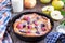 Dutch baby pancake with apple and cinnamon and fresh blueberry