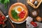 Dutch baby pancake. Fresh homemade Dutch Baby pancake with fried egg, tomato and green arugula in reed cast-iron pan on old wooden