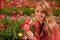 Dutch blond girl in field with tulips