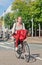 Dutch blond girl on her bicycle, Amsterdam, Netherlands