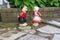 A Dutch boy and girl lawn ornaments standing with wooden shoes and traditional dutch clothes from the Netherlands in Europe wide