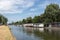 Dutch canal in city Utrecht with moored houseboats