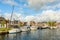 Dutch canal with moored boats on the shore, city of Lemmer