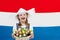 Dutch child with tulip flowers and Netherlands flag