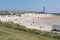 Dutch coast with seaside visitors relaxing at the beach