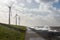 Dutch coast with wind turbines and breaking waves in heavy storm